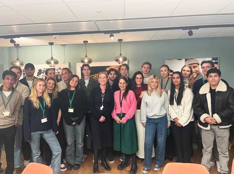 Emelie Hansson, Sustainability and Quality Manager and Linn Walenty, Head of Internal Communication, in a group picture with students.