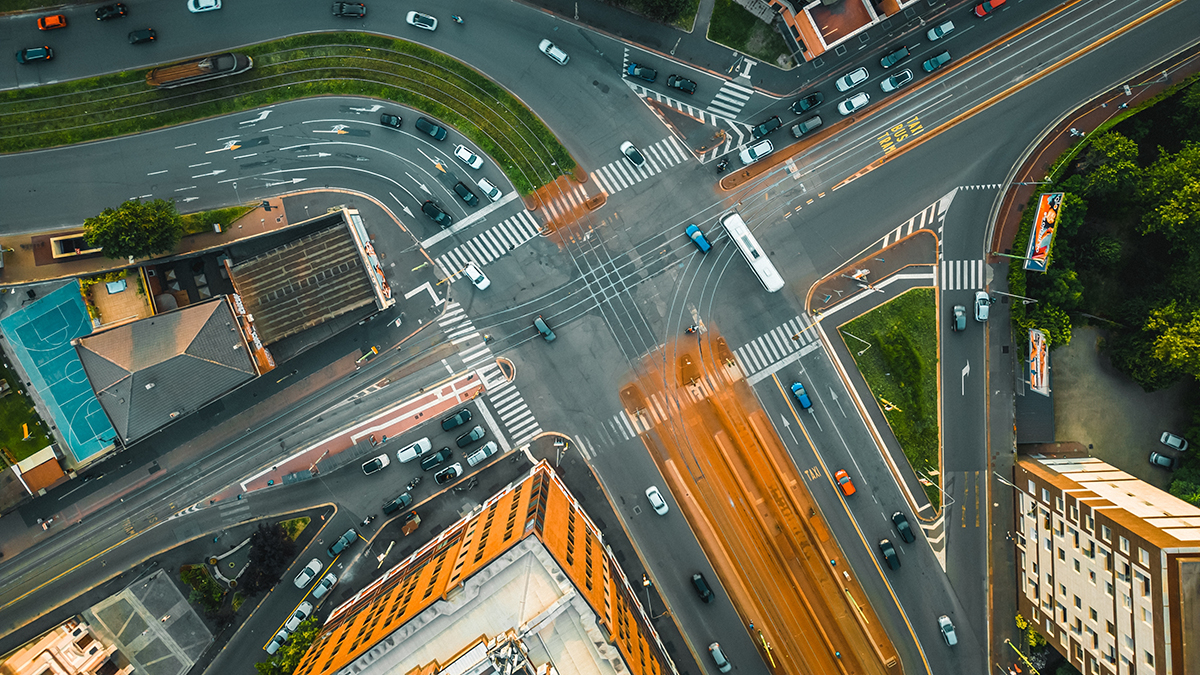 Top down view of the roofs of houses and roads in the European old town of Milan, Italy. Urban landscape. Buildings and Architecture in the city of Milan.