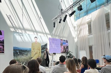 H&M representative holding a presentation for students at H&M's HQ.