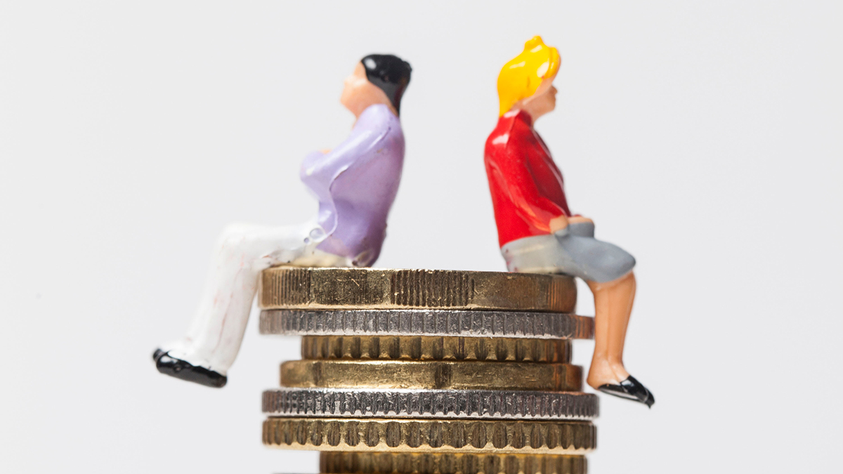 Gender pay equality concept. man and woman on a stack of coins.