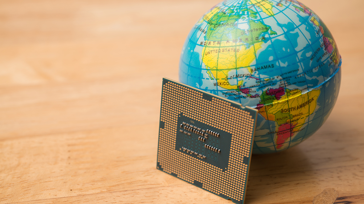 CPU (central processing unit) computer, globe on wooden table background.